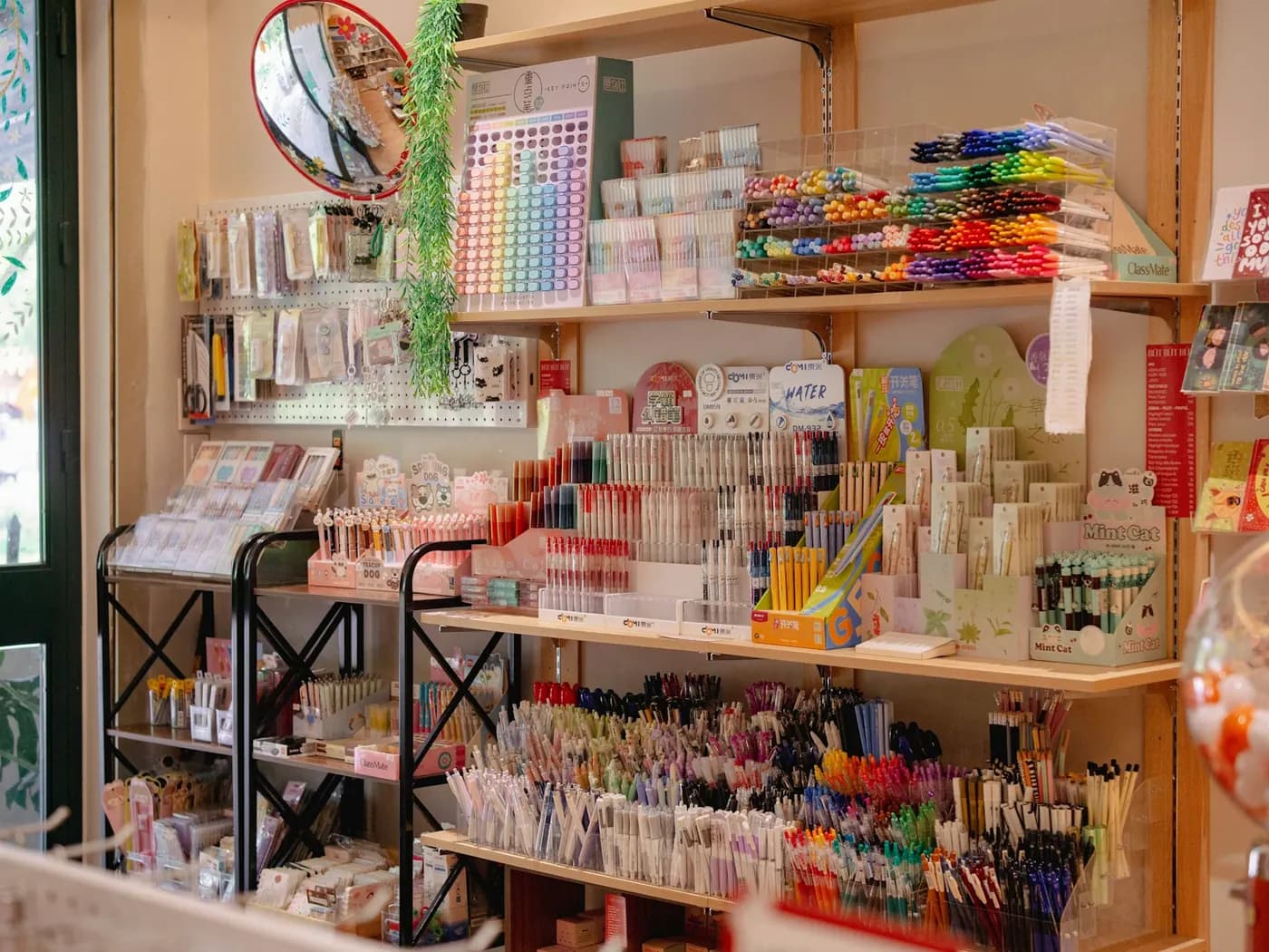 Shelves of office stationery: pens, markers, notebooks and desk supplies