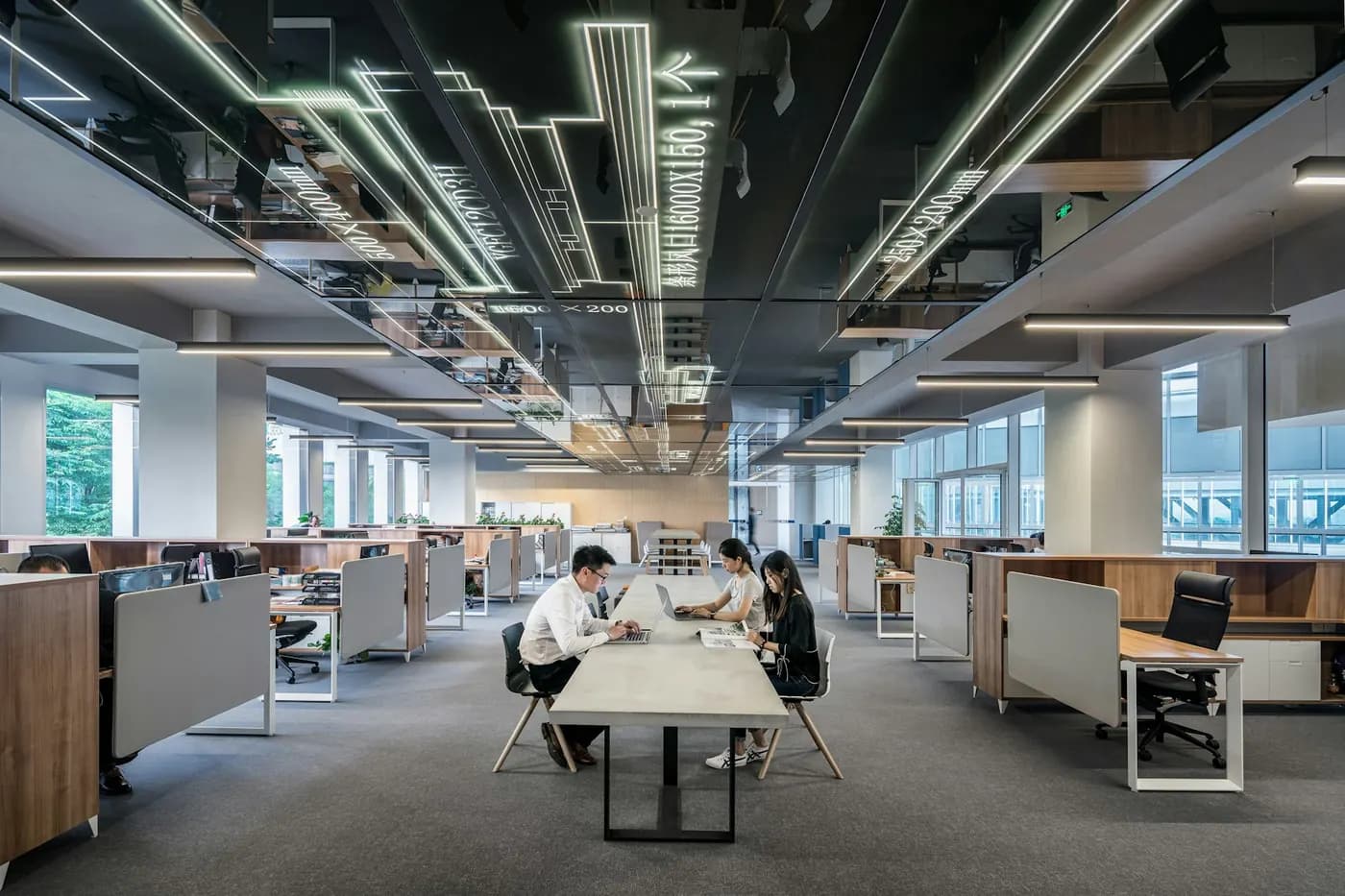 Technology company workplace with desk clusters, meeting areas and shared equipment