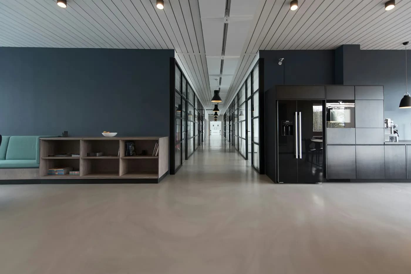 Common-area corridor and service pantry inside a commercial office building